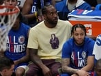 Los Angeles Clippers' Kawhi Leonard, in yellow, sits on the bench during the first half of Game 3 of a first-round NBA basketball playoff series against the Phoenix Suns in Los Angeles, Thursday, April 20, 2023. Los Angeles Clippers' Kawhi Leonard, in yellow, sits on the bench during the first half of Game 3 of a first-round NBA basketball playoff series against the Phoenix Suns in Los Angeles, Thursday, April 20, 2023.