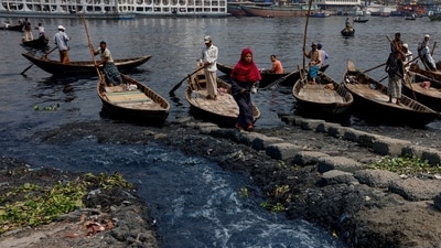 A view of dye-coloured water being discharged directly into the Buriganga river in Dhaka, Bangladesh, on March 6. In 1995, Bangladesh made it compulsory for all industrial units to use effluent treatment plants so as to keep pollution out of its rivers, but industries often flout the rule, reports Reuters.&nbsp; (Mohammad Ponir Hossain / Reuters)