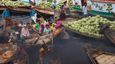 People cross the Buriganga river by boat near the Sadarghat area in Dhaka, on March 28. The South Asian nation of nearly 170 million, with about 23 million living in Dhaka, has about 220 small and large rivers and a large chunk of its population depends on rivers for a living and transport, reported Reuters.&nbsp; (Mohammad Ponir Hossain / Reuters)