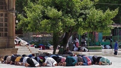 Muslim devotees offer the last Friday prayers of the Islamic holy month of Ramadan at Shah-E-Alam Shrine in Ahmedabad. (AFP) Muslim devotees offer the last Friday prayers of the Islamic holy month of Ramadan at Shah-E-Alam Shrine in Ahmedabad. (AFP)