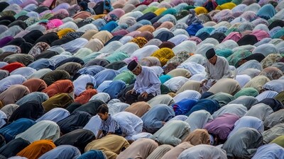 Followers of the Muhammadiyah Muslim organization take part in a morning prayer celebrating Eid Ul-Fitr. (AFP) Followers of the Muhammadiyah Muslim organization take part in a morning prayer celebrating Eid Ul-Fitr. (AFP)