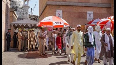 Muslim devotees come out of Gyanvapi mosque after offering prayers on the last Friday of the holy month of Ramzan, amid tight security arrangements, in Varanasi. (PTI Photo)