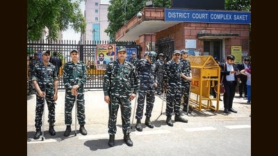 Paramilitary personnel outside the Saket Court on Friday. (Vipin Kumar/HT Photo)