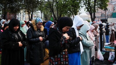 People attend Eid Ul-Fitr prayers marking the end of the fasting month of Ramadan, outside the Hagia Sophia Grand Mosque in Istanbul, Turkey. (REUTERS)