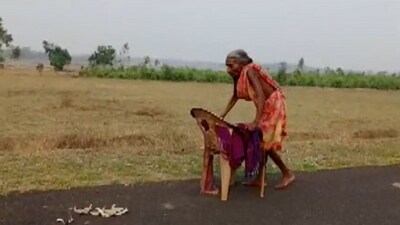 Surya Harijan was seen walking barefoot during the day with the support of a broken chair. (ANI twitter) Surya Harijan was seen walking barefoot during the day with the support of a broken chair. (ANI twitter)