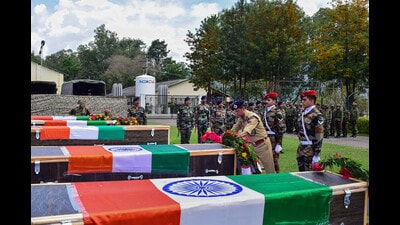 Security personnel lay a wreath near the mortal remains of five soldiers, who were killed in a terrorist attack in Jammu and Kashmir’s Poonch district, on Friday. (PTI) Security personnel lay a wreath near the mortal remains of five soldiers, who were killed in a terrorist attack in Jammu and Kashmir’s Poonch district, on Friday. (PTI)
