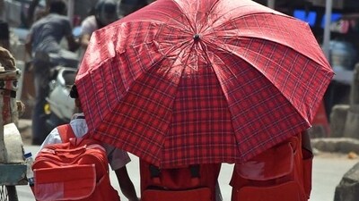 Students protect themselves from the scorching heat amid intense heatwave across India. (ANI Photo) Students protect themselves from the scorching heat amid intense heatwave across India. (ANI Photo)