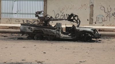A destroyed military vehicle is seen in southern in Khartoum, Sudan, Thursday, April 20, 2023. The latest attempt at a cease-fire between the rival Sudanese forces faltered as gunfire rattled the capital of Khartoum. Through the night and into Thursday morning, gunfire could be heard almost constantly across Khartoum. (AP)