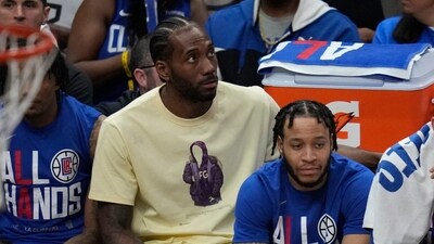 Los Angeles Clippers' Kawhi Leonard, in yellow, sits on the bench during the first half of Game 3 of a first-round NBA basketball playoff series against the Phoenix Suns in Los Angeles, Thursday, April 20, 2023. (AP) Los Angeles Clippers' Kawhi Leonard, in yellow, sits on the bench during the first half of Game 3 of a first-round NBA basketball playoff series against the Phoenix Suns in Los Angeles, Thursday, April 20, 2023. (AP)