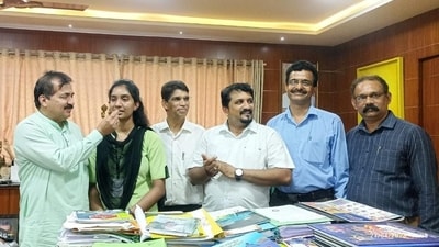 Chairman Dr m Mohan alva and Principal Mohammed Sadakath with topper Chairman Dr m Mohan alva and Principal Mohammed Sadakath with topper