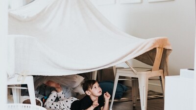 Build A Fort: Building a fort creates a sense of adventure and excitement for children. Gather blankets, sheets, and pillows and help your child build a fort. This activity also encourages imagination and pretending. (Unsplash)