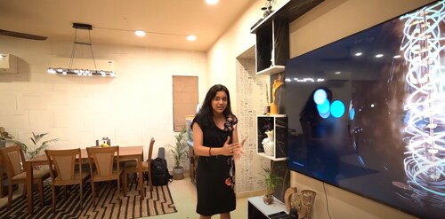 Sumbul Touqeer inside her living room with a massive TV unit. Sumbul Touqeer inside her living room with a massive TV unit.