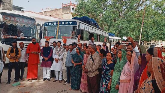 Char Dham Pilgrims being flagged off from Maya Devi shrine on Friday in Haridwar. (HT Photo)