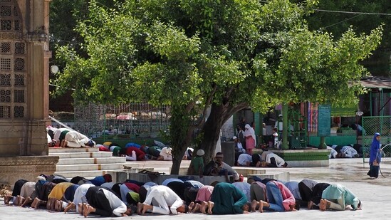 Muslim devotees offer the last Friday prayers of the Islamic holy month of Ramadan at Shah-E-Alam Shrine in Ahmedabad.(AFP)