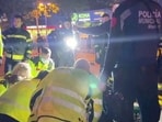 Rescuers work outside a restaurant following a fire, in Madrid, Spain, April 21, 2023, in this screen grab taken from a handout video. 