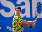 Spain's Carlos Alcaraz returns the ball to Spain's Alejandro Davidovich during the ATP Barcelona Open "Conde de Godo" tennis tournament singles match at the Real Club de Tenis in Barcelona on April 21, 2023. (Photo by Josep LAGO / AFP)