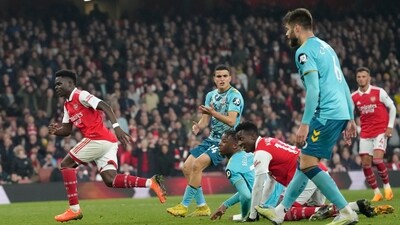 Arsenal's Bukayo Saka, left, celebrates after scoring during the English Premier League soccer match between Arsenal and Southampton at Emirates stadium in London, Friday, April 21, 2023. (AP Photo/Kirsty Wigglesworth) (AP) Arsenal's Bukayo Saka, left, celebrates after scoring during the English Premier League soccer match between Arsenal and Southampton at Emirates stadium in London, Friday, April 21, 2023. (AP Photo/Kirsty Wigglesworth) (AP)