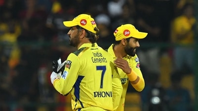 Chennai Super Kings' Mahendra Singh Dhoni greet Ravindra Jadeja after winning the Indian Premier League (IPL) Twenty20 cricket match between Royal Challengers Bangalore and Chennai Super Kings at the M Chinnaswamy Stadium in Bengaluru on April 17, 2023. (Photo by Manjunath KIRAN / AFP) (AFP)