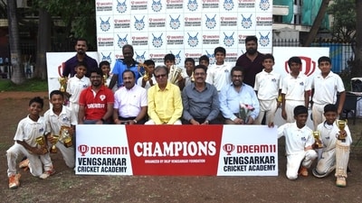 Former India captain Dilip Vengsarkar and all-rounder Karsan Ghavri pose with the victorious MIG CC team. Former India captain Dilip Vengsarkar and all-rounder Karsan Ghavri pose with the victorious MIG CC team.