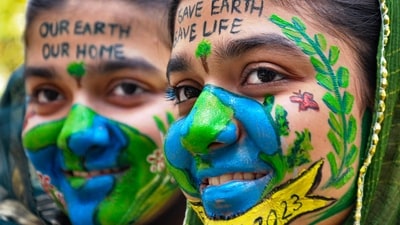 Moradabad: Young women with the messages painted on their faces urging to save the earth at a programme, on the eve of the Earth Day, in Moradabad, UP on Friday, (PTI) Moradabad: Young women with the messages painted on their faces urging to save the earth at a programme, on the eve of the Earth Day, in Moradabad, UP on Friday, (PTI)