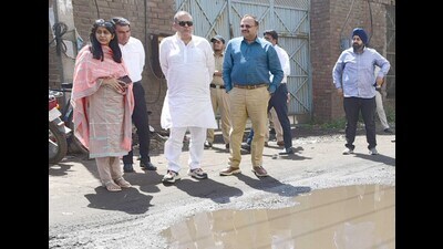 Rajya Sabha MP Sanjeev Arora, MC Commissioner Shena Aggarwal, along with senior officials of MC during visit to Focal Point for road inspection in Ludhiana on Saturday. (HT Photo) Rajya Sabha MP Sanjeev Arora, MC Commissioner Shena Aggarwal, along with senior officials of MC during visit to Focal Point for road inspection in Ludhiana on Saturday. (HT Photo)