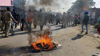 Security personnel try to control the situation after violent protests by locals over the death of a minor girl, in North Dinajpur district of West Bengal, on Saturday. (PTI) Security personnel try to control the situation after violent protests by locals over the death of a minor girl, in North Dinajpur district of West Bengal, on Saturday. (PTI)