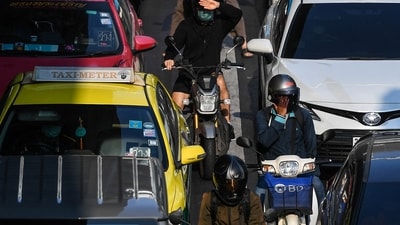 Thailand Heat Wave: Motorbike riders wait at the traffic light as temperatures hit a record 45.4 degrees Celsius (113.7 Fahrenheit) in Bangkok, Thailand. (Reuters)