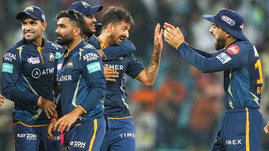 Gujarat Titans players celebrate a wicket of Lucknow Super Giants during the IPL 2023 match between the two sides at Ekana Stadium in Lucknow.(PTI)