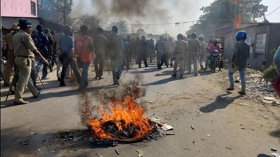 Security personnel try to control the situation after violent protests by locals over the death of a minor girl, in North Dinajpur district of West Bengal, on Saturday. (PTI)