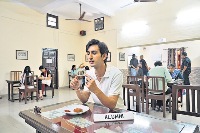 Koul relishes a mince cutlet at the college’s cafe. Koul relishes a mince cutlet at the college’s cafe.