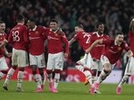 Manchester United players celebrate after winning the English FA Cup semifinal soccer match between Brighton and Hove Albion and Manchester United at Wembley Stadium in London, Sunday, April 23, 2023. (AP Photo/Kirsty Wigglesworth)