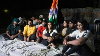 Wrestlers Vinesh Phogat, Bajrang Punia, Sangeeta Phogat, Sakshi Malik during their sit-in-protest against Wrestling Federation of India (WFI) chief Brij Bhushan Singh, at Jantar Mantar, in New Delhi. (ANI) Wrestlers Vinesh Phogat, Bajrang Punia, Sangeeta Phogat, Sakshi Malik during their sit-in-protest against Wrestling Federation of India (WFI) chief Brij Bhushan Singh, at Jantar Mantar, in New Delhi. (ANI)
