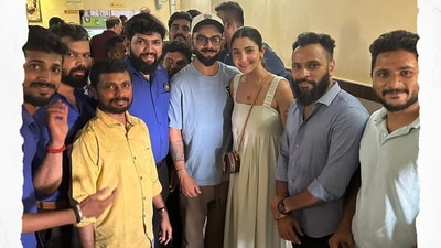 Anushka Sharma and Virat Kohli posed with the staff of CTR.