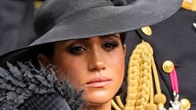 Meghan Markle: Meghan, Duchess of Sussex watches as the coffin of Queen Elizabeth II is placed into the hearse. (AP)