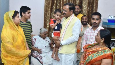 Deputy chief minister Keshav Prasad Maurya met family members of slain lawyer Umesh Pal in Prayagraj on Sunday. (HT Photo)