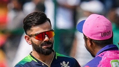 Bengaluru: Royal Challengers Bangalore captain Virat Kohli with Rajasthan Royals Captain Sanju Samson during the toss ceremony before the start of the IPL 2023 match between Royal Challengers Bangalore and Rajasthan Royals, at M Chinnaswamy Stadium in Bengaluru, Sunday, April 23, 2023. (PTI Photo/Shailendra Bhojak)(PTI04_23_2023_000077A) (PTI) Bengaluru: Royal Challengers Bangalore captain Virat Kohli with Rajasthan Royals Captain Sanju Samson during the toss ceremony before the start of the IPL 2023 match between Royal Challengers Bangalore and Rajasthan Royals, at M Chinnaswamy Stadium in Bengaluru, Sunday, April 23, 2023. (PTI Photo/Shailendra Bhojak)(PTI04_23_2023_000077A) (PTI)