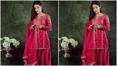 Shehnaaz decked up in a bright pink sharara set. The short kurta featured intricate embroidery work in golden resham threads. The matching sharara set featured golden embroidery work at the borders. (Instagram/@shehnaazgill) Shehnaaz decked up in a bright pink sharara set. The short kurta featured intricate embroidery work in golden resham threads. The matching sharara set featured golden embroidery work at the borders. (Instagram/@shehnaazgill)