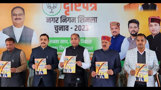 Former chief minister Jai Ram Thakur with ex-BJP state chief Suresh Kashyap and other BJP leaders releasing the Shimla MC manifesto in Shimla on Sunday. (Deepak Sansta/HT)