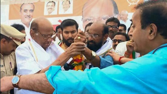 Nagpur: Nationalist Congress Party (NCP) President Sharad Pawar being welcomed by party workers at Kondhali village, while former Maharashtra Home Minister Anil Deshmukh looks on, on the outskirt of Nagpur, Sunday, April 23, 2023. (PTI Photo) (PTI04_23_2023_000398A) (PTI)