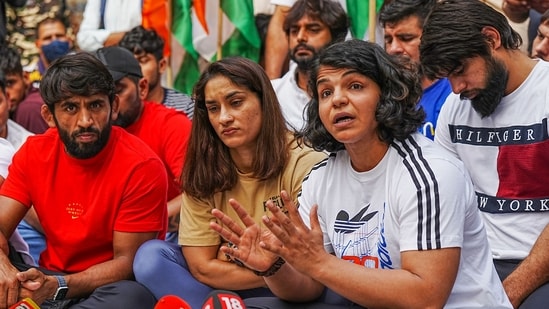Bajrang Punia, Vinesh Phogat and Sakshi Malik during a press conference regarding wrestlers' protest at Jantar Mantar in New Delhi Sunday, April 23, 2023. (PTI)