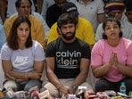 Indian wrestlers Vinesh Phogat, Bajrang Punia, and Sakshi Malik address a news conference as they take part in a sit-in protest demanding arrest of Wrestling Federation of India (WFI) chief. 