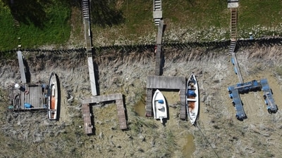 Boats lie on the dried shipyard on the Po River in Torricella, near Cremona, Italy, Italy's largest river is already as low as it was last summer, sparking fears of precariously dry months ahead. Cruise bookings may cancel at Italy's Po River due to a desperately dry summer (AP Photo/Luca Bruno) Boats lie on the dried shipyard on the Po River in Torricella, near Cremona, Italy, Italy's largest river is already as low as it was last summer, sparking fears of precariously dry months ahead. Cruise bookings may cancel at Italy's Po River due to a desperately dry summer (AP Photo/Luca Bruno)