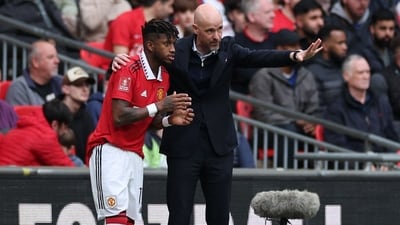 Manchester United's Dutch manager Erik ten Hag (R) gives instructions to Manchester United's Brazilian midfielder Fred (AFP) Manchester United's Dutch manager Erik ten Hag (R) gives instructions to Manchester United's Brazilian midfielder Fred (AFP)