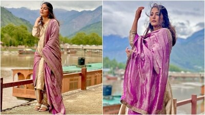 Hina's suit set features an embroidered gold-coloured anarkali, straight-fit pants, and a georgette dupatta decked with patti borders. She accessorised the ensemble with jhumkis and juttis. (Instagram) Hina's suit set features an embroidered gold-coloured anarkali, straight-fit pants, and a georgette dupatta decked with patti borders. She accessorised the ensemble with jhumkis and juttis. (Instagram)