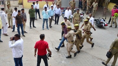 This photo shows a police special investigation team (SIT) re-enacting events at the crime scene where gangster-turned-politician Atiq Ahmad and his brother Ashraf Ahmad were shot dead by unidentified assailants outside a hospital while being taken for a medical checkup in police custody, in Prayagraj. (AFP)