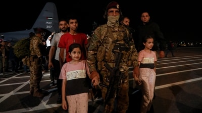 Jordanians evacuated from Sudan arrive at a military airport in Amman, Jordan. (AP) Jordanians evacuated from Sudan arrive at a military airport in Amman, Jordan. (AP)