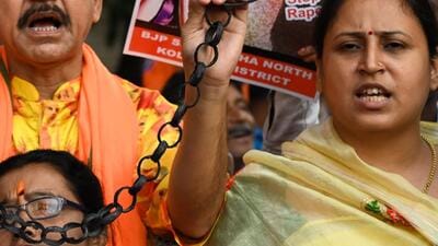 Members of BJP SC Morcha during their protest over the death of minor girl at Kaliaganj of North Dinajpur in Kolkata on Monday (PTI) Members of BJP SC Morcha during their protest over the death of minor girl at Kaliaganj of North Dinajpur in Kolkata on Monday (PTI)