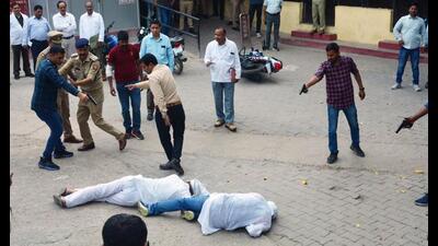 Special Investigation Team (SIT) and the forensic team recreate the crime scene, where three assailants shot dead gangster-turned-politician Atiq Ahmed and his brother Ashraf on April 15, in Prayagraj . (ANI Photo)