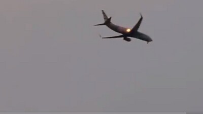 Engine of plane catches fire after bird strike (Screengrab)