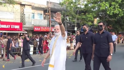 PM Modi waving to the crowd of supporters during road show in Kerala's Kochi on Monday. PM Modi waving to the crowd of supporters during road show in Kerala's Kochi on Monday.